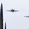 Captains Christopher Hurst and Cimicata fly over the NAS Lemoore hangars in their prelude to the change of command.